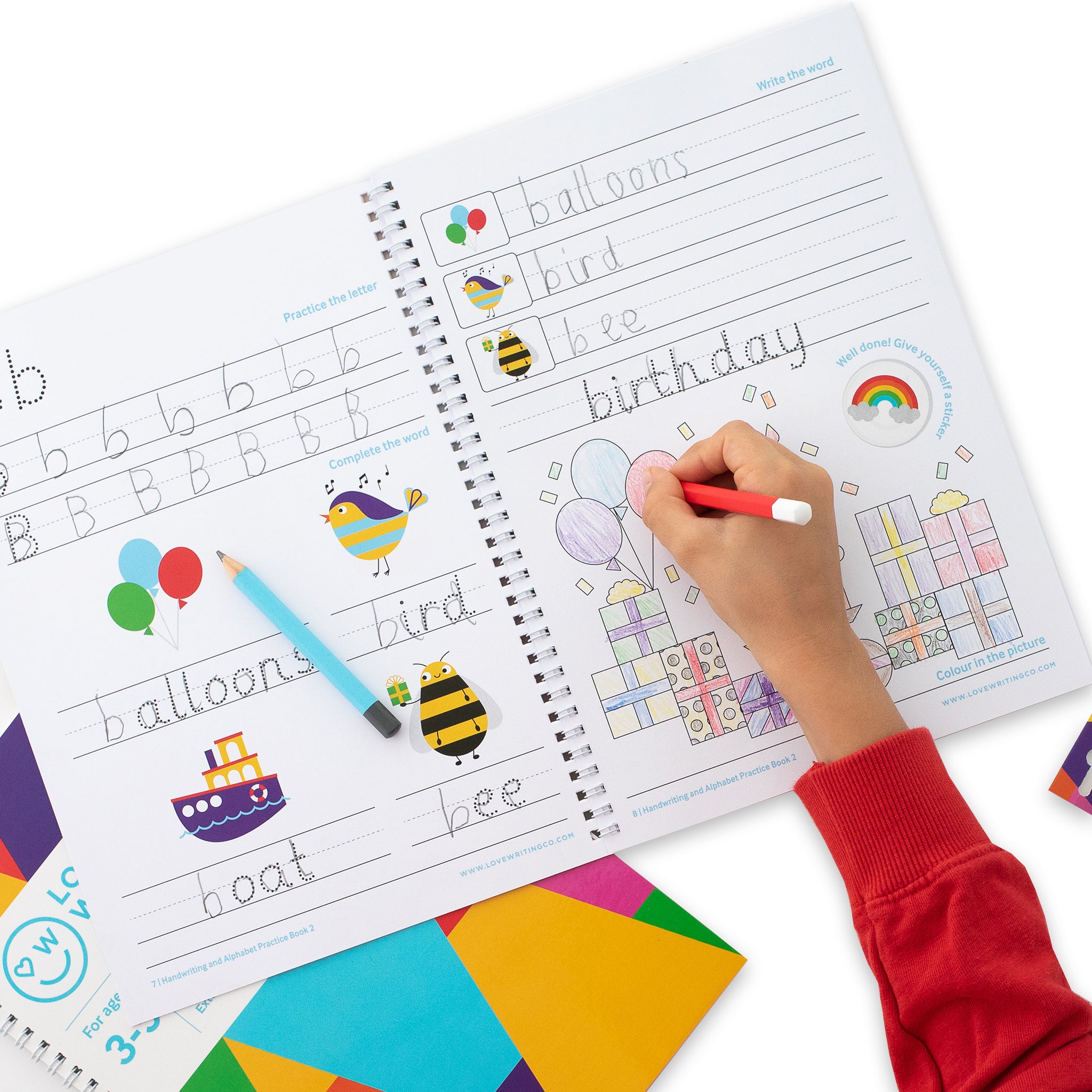 Child drawing in workbook and learning alphabet